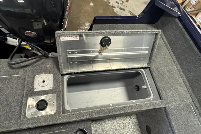 Slide: The Image of 2026 Tracker Pro Guide V-175 WT boat interior with open storage compartment. - 9