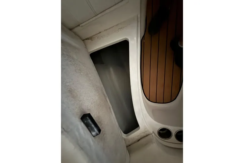 Slide: The Image of Interior view of 2012 Bayliner 235 Bowrider boat, featuring seating and flooring details. - 36