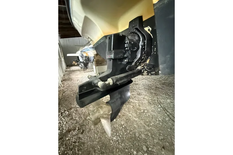Slide: The Image of 2012 Bayliner 235 Bowrider boat propeller and stern drive in storage. - 9