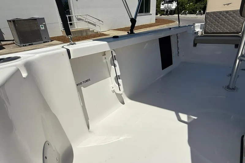 Slide: The Image of 2021 Tidewater 1910 Bay Max boat interior with rod tubes and seating area. - 12