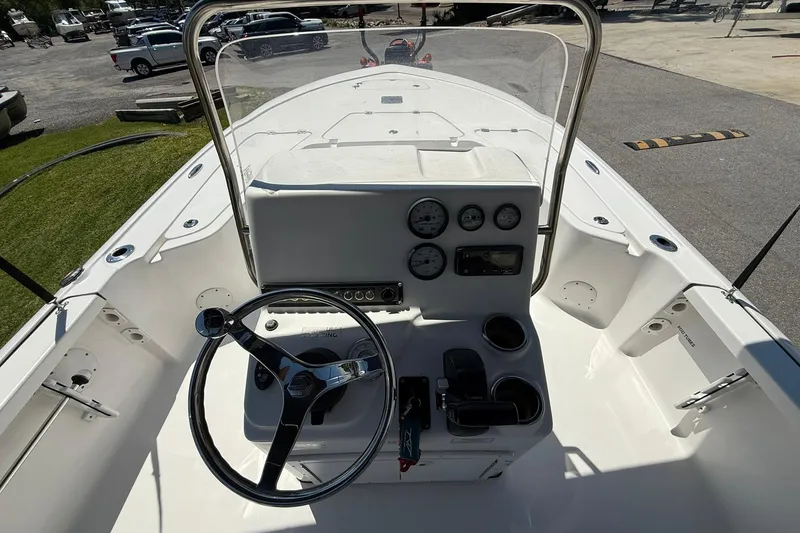 Slide: The Image of Cockpit view of 2021 Tidewater 1910 Bay Max boat with steering wheel and gauges. - 13