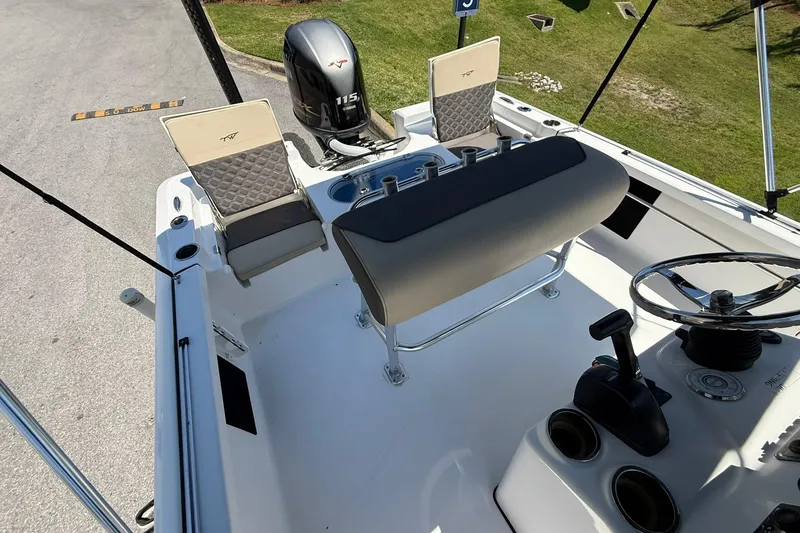 Slide: The Image of 2021 Tidewater 1910 Bay Max boat interior with seating and steering wheel. - 18