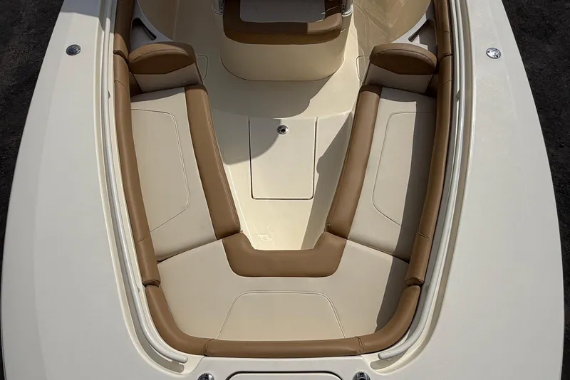 Slide: The Image of 2019 Scout 275 LXF boat interior with tan and cream seating arrangement. - 14