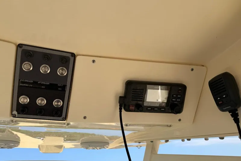 Slide: The Image of Control panel and radio equipment on a 2019 Scout 275 LXF boat. - 22