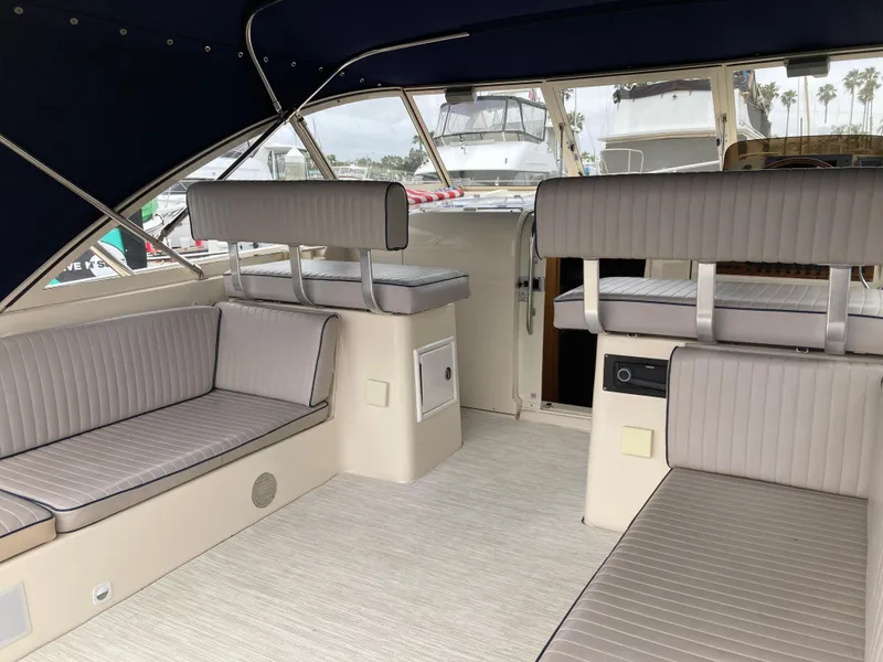 Slide: The Image of 2004 Mainship Pilot 34 interior with gray seating and spacious layout. - 19