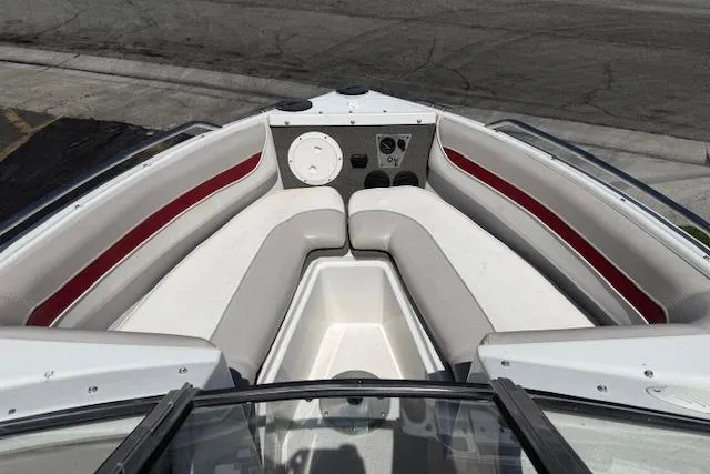 Slide: The Image of 1996 Four Winns 190 Horizon boat interior with white and red seating. - 11