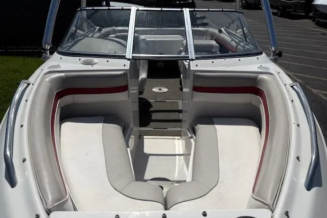 Slide: The Image of 1996 Four Winns 190 Horizon boat interior with white and red seating, open bow design. - 17
