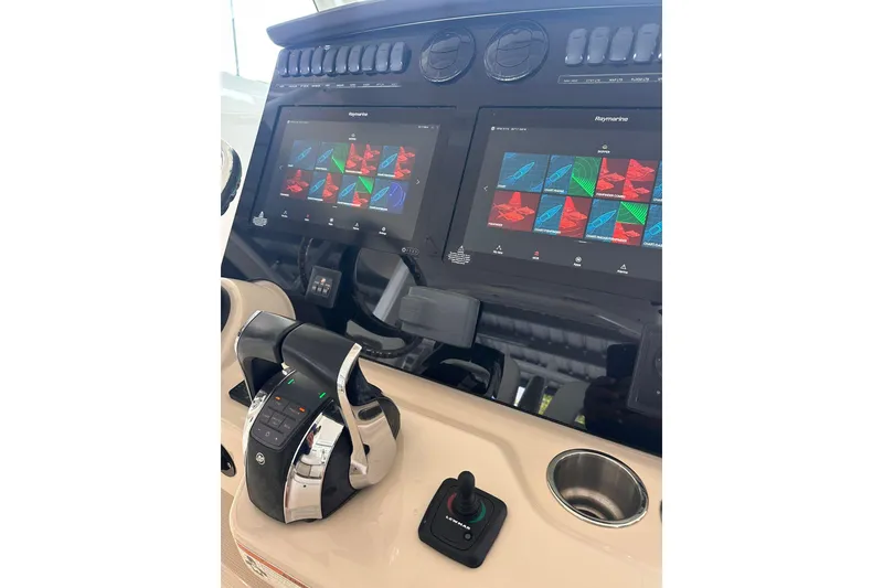 Slide: The Image of Control panel of a 2019 Boston Whaler 380 Outrage with advanced navigation displays. - 10