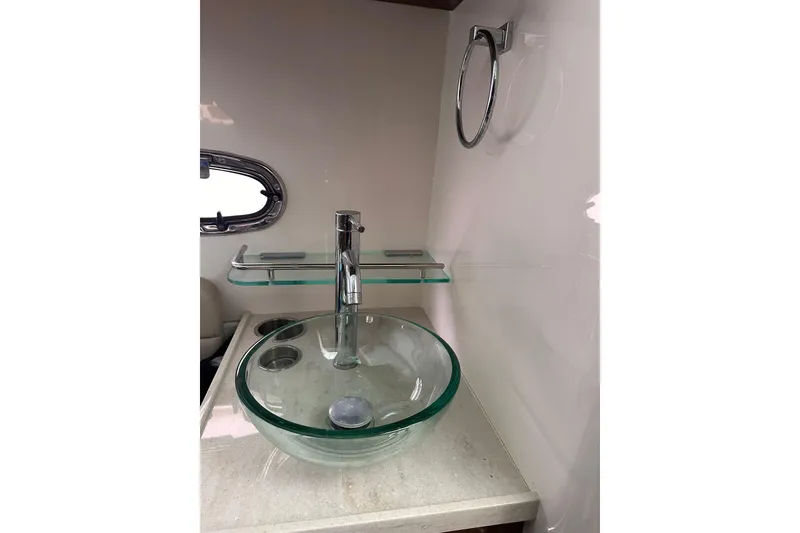 Slide: The Image of Modern glass sink in 2019 Boston Whaler 380 Outrage boat bathroom. - 16