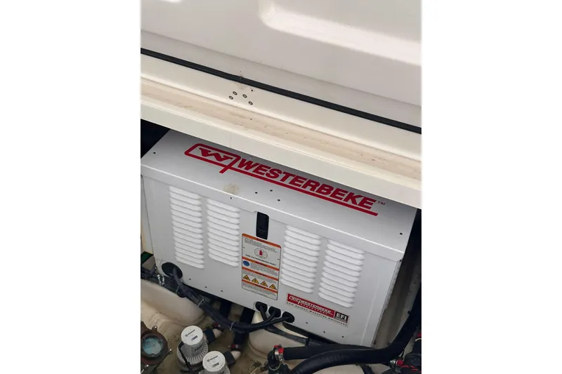 Slide: The Image of Westerbeke generator in a 2019 Boston Whaler 380 Outrage boat engine compartment. - 19