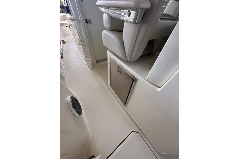 Slide: The Image of Interior view of a 2019 Boston Whaler 380 Outrage boat, featuring seating and storage. - 7