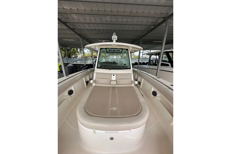 Slide: The Image of 2019 Boston Whaler 380 Outrage boat interior under covered dock. - 9