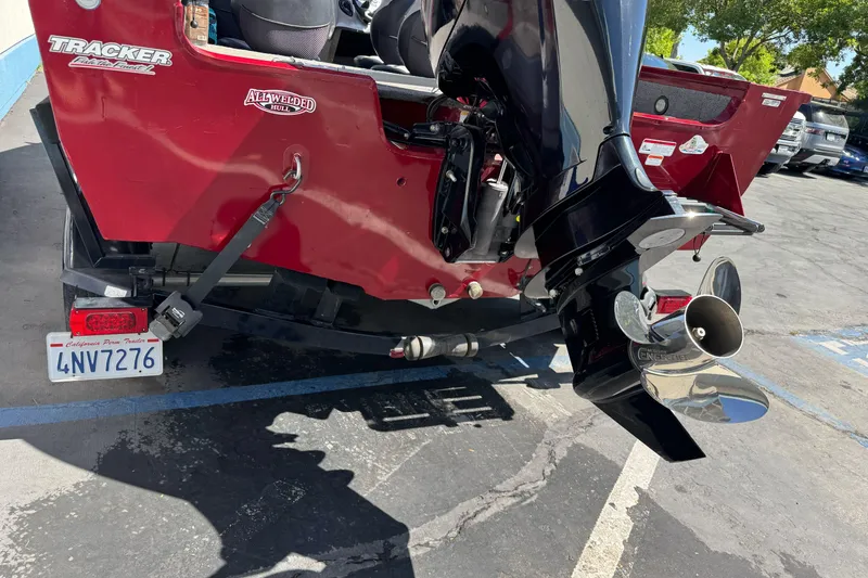 Slide: The Image of 2015 Tracker Targa V-18 Combo boat with outboard motor and California trailer plate. - 10