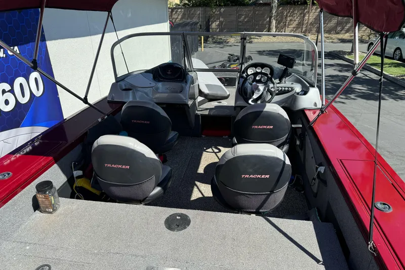 Slide: The Image of 2015 Tracker Targa V-18 Combo boat interior with seating and dashboard. - 11