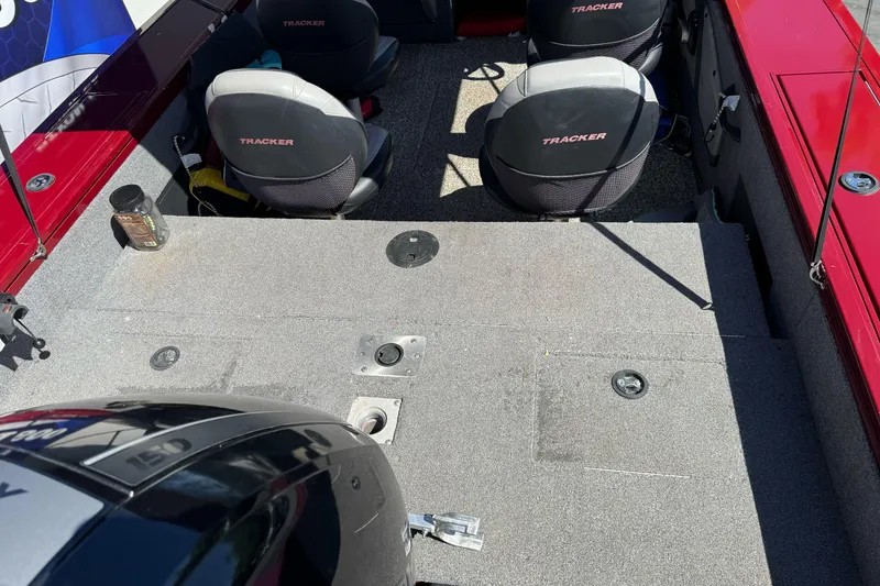 Slide: The Image of 2015 Tracker Targa V-18 Combo boat interior with seating and motor view. - 12