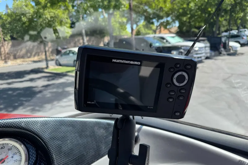 Slide: The Image of Humminbird GPS device mounted on 2015 Tracker Targa V-18 Combo dashboard. - 14
