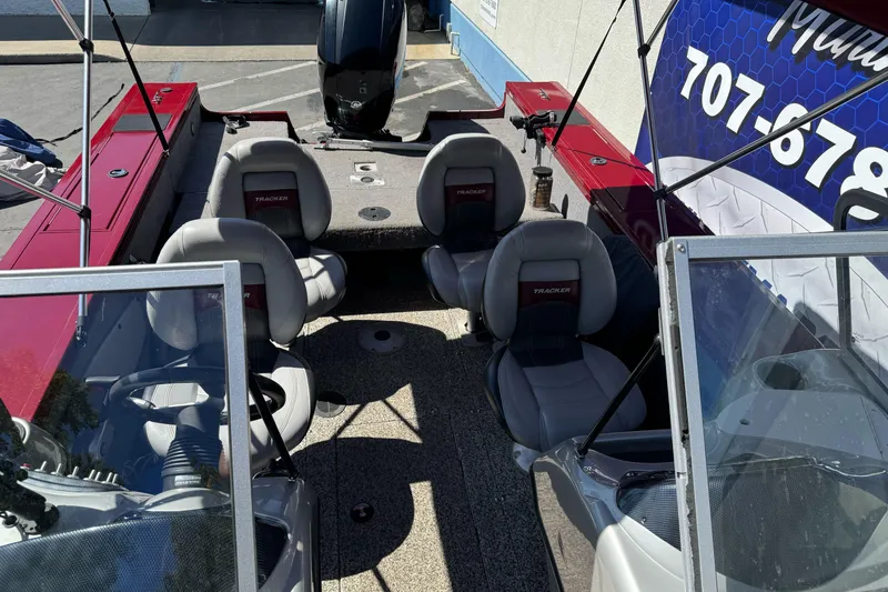 Slide: The Image of 2015 Tracker Targa V-18 Combo boat interior with seating and steering console. - 17