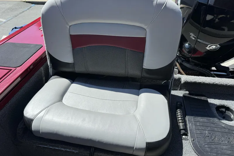 Slide: The Image of 2015 Tracker Targa V-18 Combo boat seat with gray and maroon upholstery. - 21
