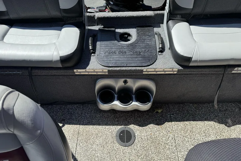 Slide: The Image of Interior of 2015 Tracker Targa V-18 Combo boat with seating and cup holders. - 23