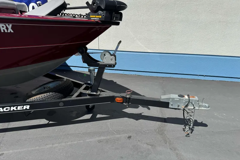Slide: The Image of 2015 Tracker Targa V-18 Combo boat on trailer, parked on pavement. - 6