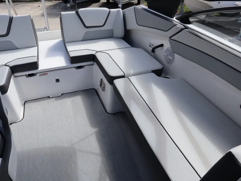 Slide: The Image of Interior of 2025 Yamaha Boats AR220 with gray upholstered seating. - 13