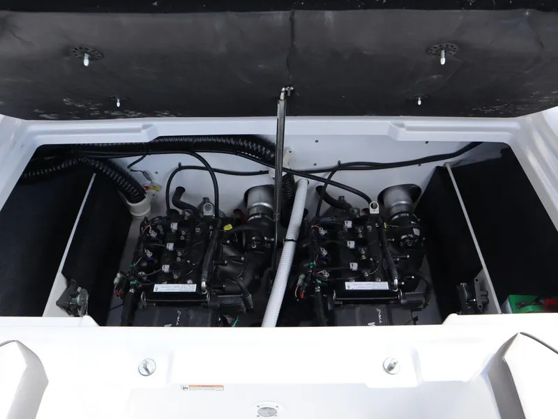Slide: The Image of Engine compartment of 2025 Yamaha Boats AR220 with dual engines. - 17