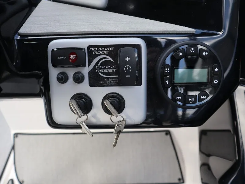 Slide: The Image of Yamaha AR220 2025 boat console with controls and keys. - 6