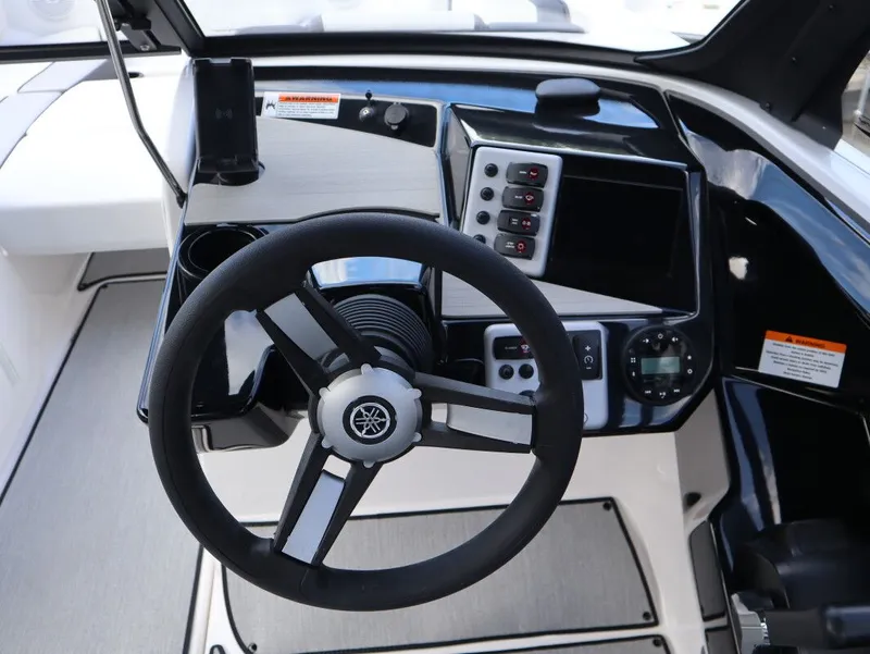 Slide: The Image of Yamaha Boats AR220 2025 steering console with wheel and controls. - 7
