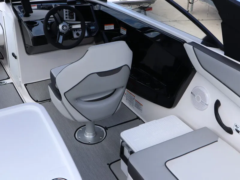 Slide: The Image of Interior of 2025 Yamaha Boats AR220 with helm console and seating. - 9