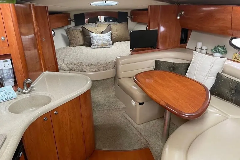 Slide: The Image of Luxurious interior of a 2007 Larson Cabrio 350 yacht with cozy seating and elegant wood finishes. - 11