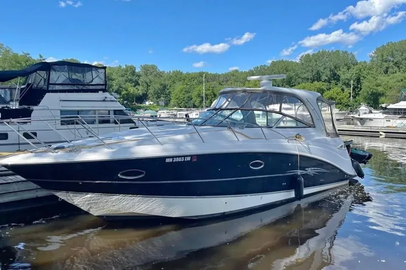 The Image of 2007 Larson Cabrio 350 boat docked on a sunny day with clear skies. - 2