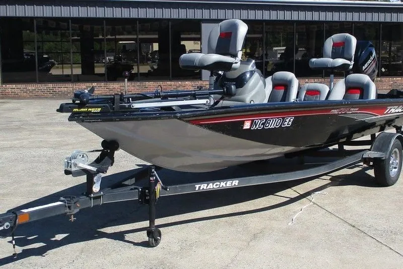 The Image of 2017 Tracker Pro Team 175 TXW fishing boat on trailer, parked outdoors. - 1