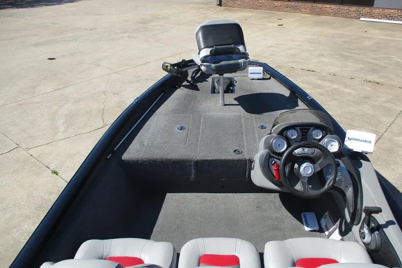 Slide: The Image of 2017 Tracker Pro Team 175 TXW boat interior with steering console and seating. - 3