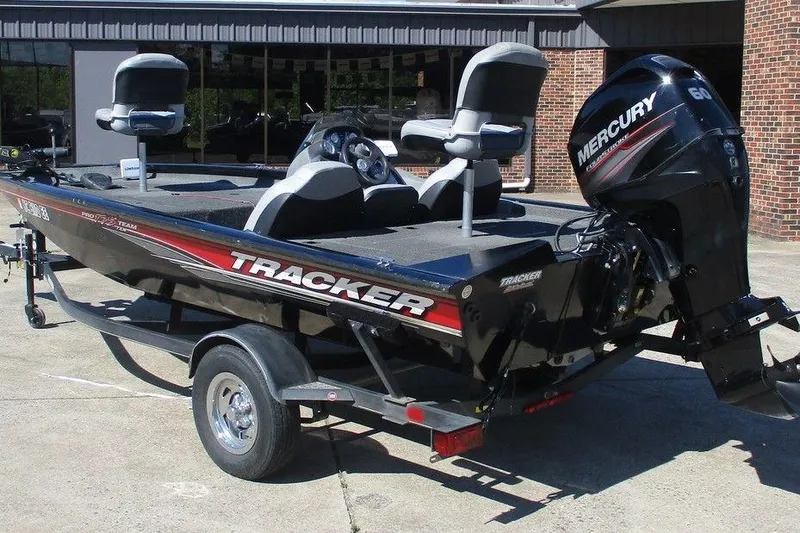 Slide: The Image of 2017 Tracker Pro Team 175 TXW boat with Mercury engine on trailer. - 4