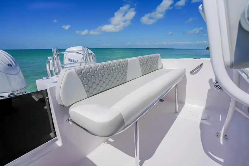 Slide: The Image of 2026 Twin Vee 240 GFX CC boat interior with sleek seating and ocean view. - 14