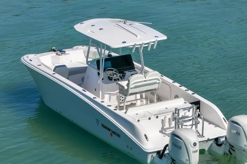 Slide: The Image of 2026 Twin Vee 240 GFX CC boat on clear water, featuring dual Yamaha engines. - 37
