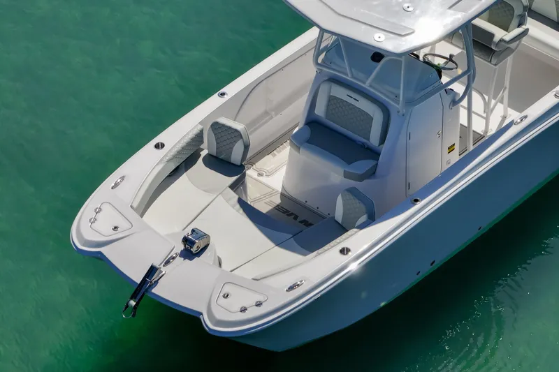 Slide: The Image of 2026 Twin Vee 240 GFX CC boat on clear turquoise water, showcasing sleek design. - 39
