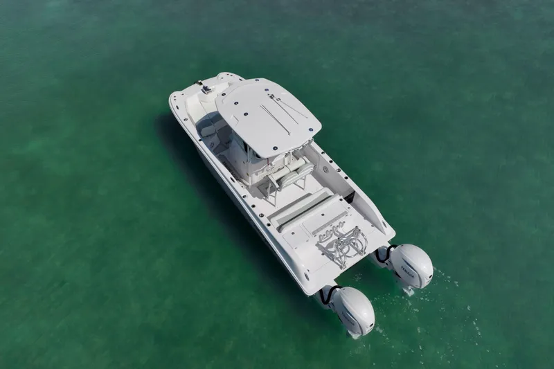 Slide: The Image of Aerial view of 2026 Twin Vee 240 GFX CC boat on clear water. - 41