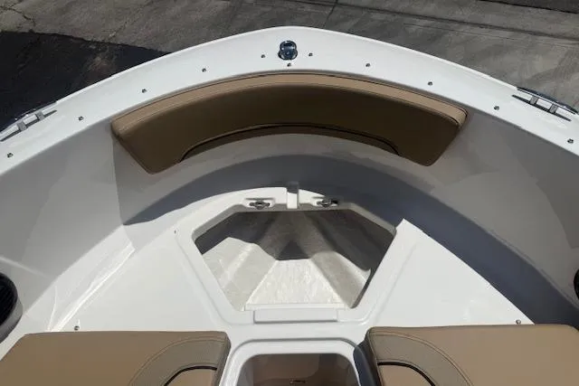 Slide: The Image of Bow seating area of 2026 Bayliner V20i boat with tan cushions. - 12