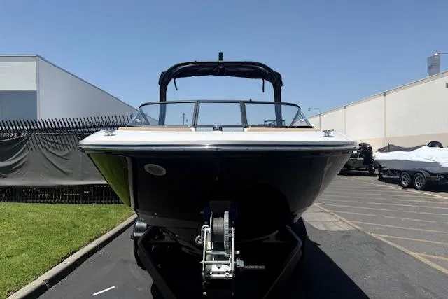 Slide: The Image of 2026 Bayliner V20i boat parked outdoors on a sunny day. - 13