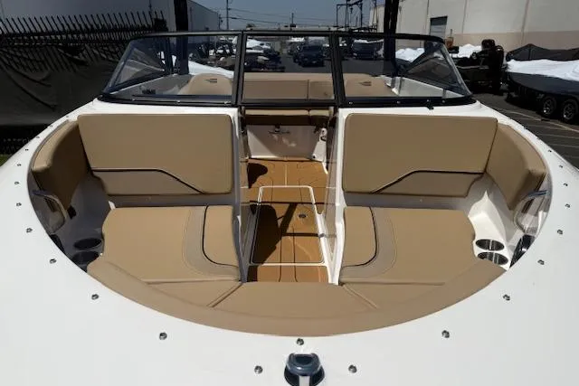 Slide: The Image of 2026 Bayliner V20i boat interior with tan seating and sleek design. - 26