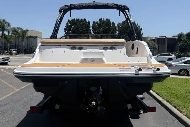 Slide: The Image of 2026 Bayliner V20i boat rear view in a parking lot, showcasing sleek design and modern features. - 4