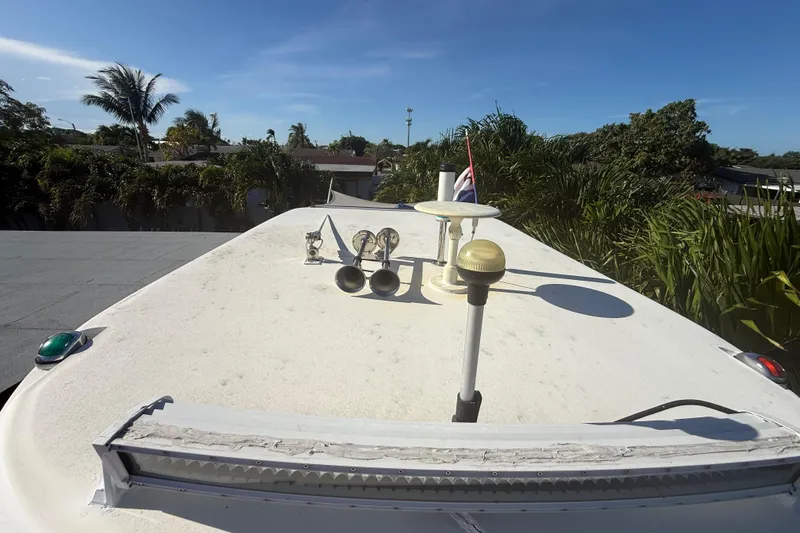 Slide: The Image of Rooftop view of a 1996 Grady-White Sailfish 272 boat with antennas and horns. - 104