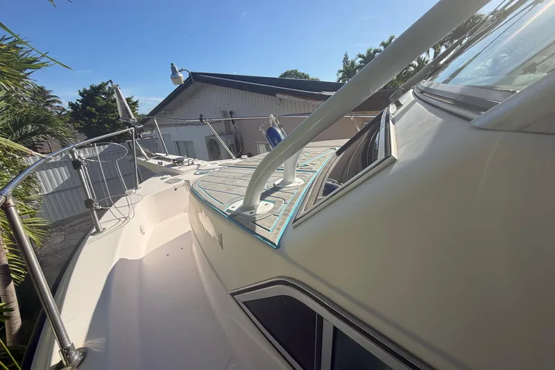 Slide: The Image of 1996 Grady-White Sailfish 272 boat deck, sunny day, residential background. - 110