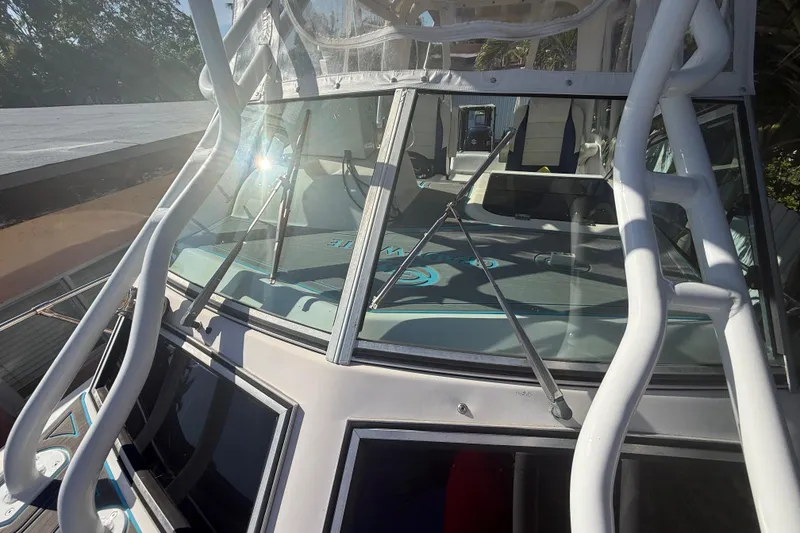 Slide: The Image of 1996 Grady-White Sailfish 272 boat with windshield and metal framework in sunlight. - 114