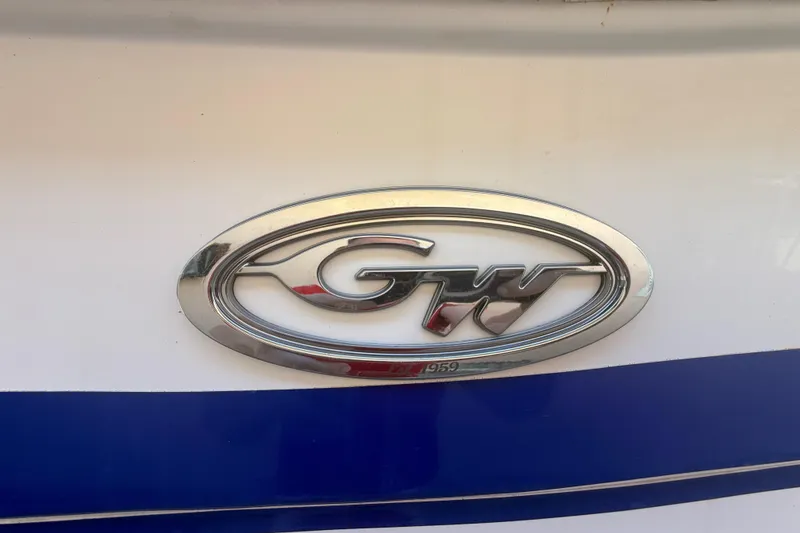Slide: The Image of Grady-White Sailfish 272 emblem on a 1996 model boat with blue stripe. - 116