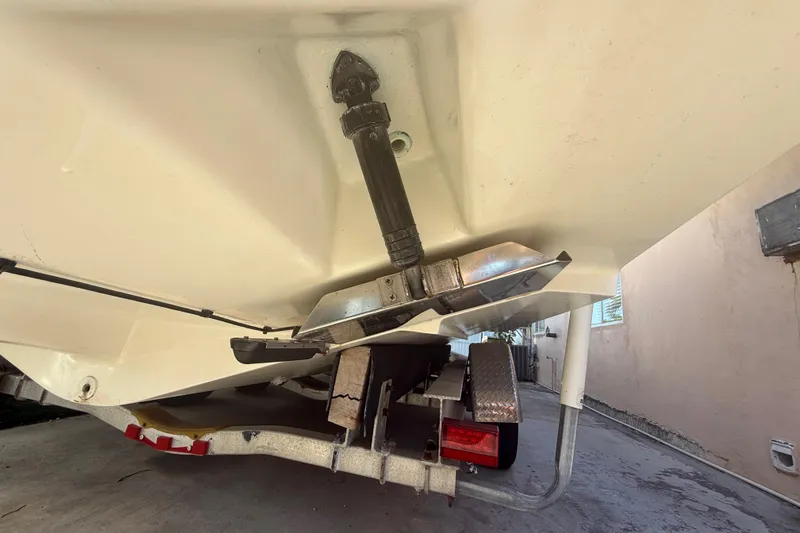 Slide: The Image of 1996 Grady-White Sailfish 272 boat hull and trailer detail, showcasing underside components. - 123