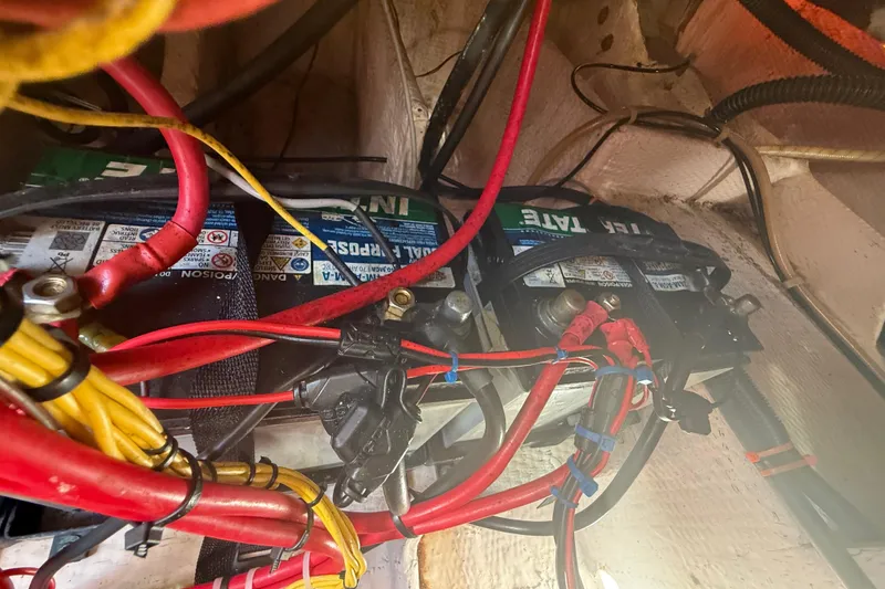 Slide: The Image of Battery compartment of a 1996 Grady-White Sailfish 272 with wiring and connections. - 135