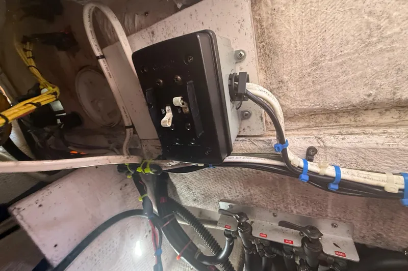 Slide: The Image of Electrical wiring and panel inside a 1996 Grady-White Sailfish 272 boat. - 136