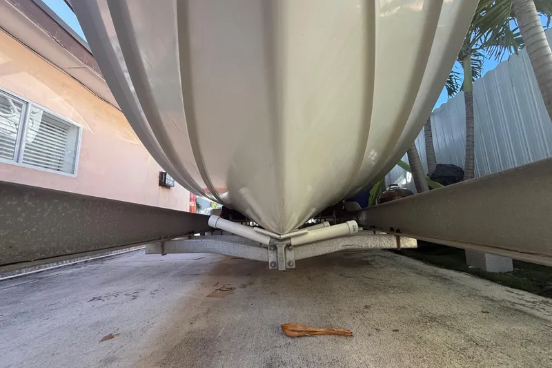 Slide: The Image of 1996 Grady-White Sailfish 272 boat hull on trailer, viewed from below. - 14